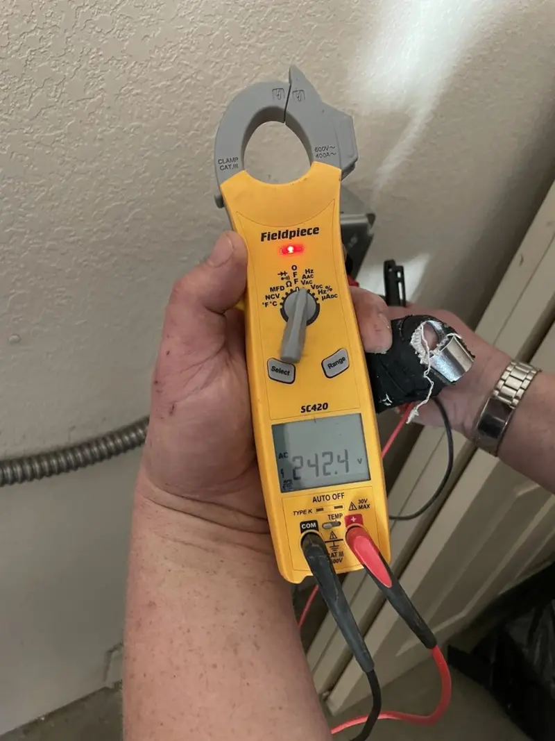 Voltage testing with clamp meter during Electrical Installation Services in Flagler Estates